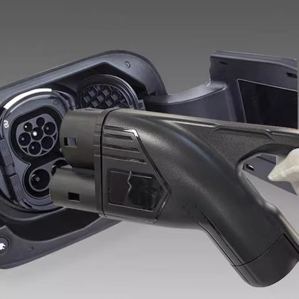 Close-up of a black CCS2 DC fast-charging connector for electric cars and EV charging cables