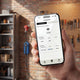 Mobile app charging overview next to a red CEE portable charger in a garage
